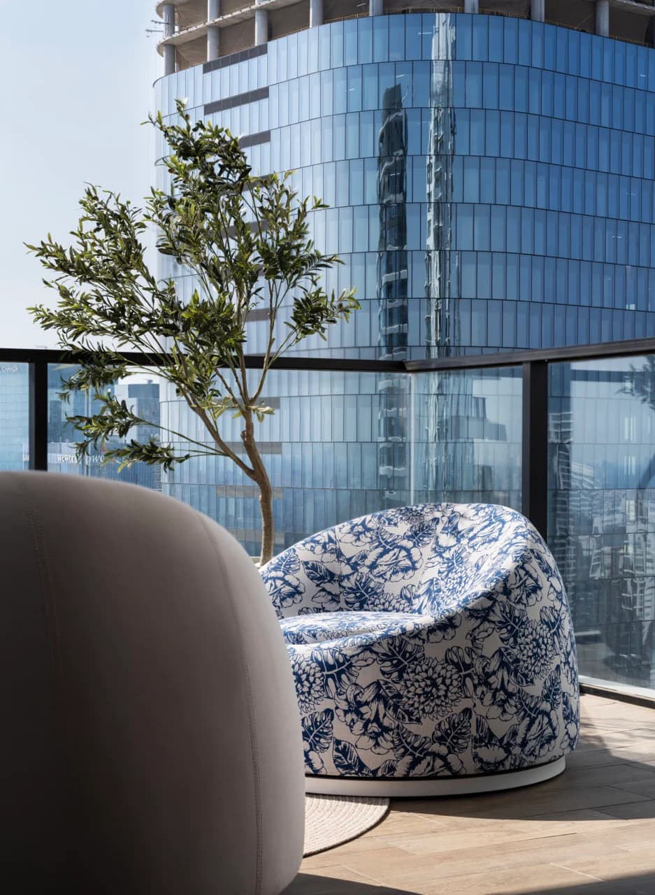 Blue patterned Duba armchair in an urban balcony project